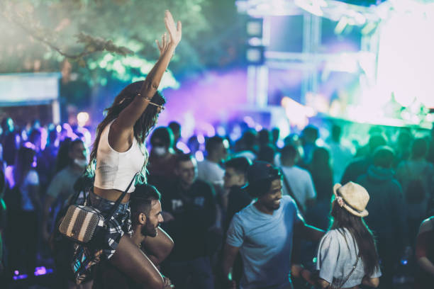 istock Happy friends having fun while dancing on a music festival. 1191819344