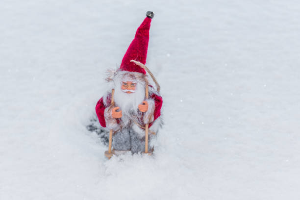 istock Santa Doll with Skis on Snow for Christmas 1191820618