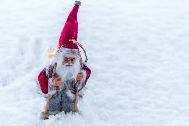 istock Santa Doll with Skis on Snow for Christmas 1191820773