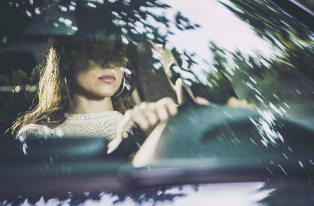 istock Young beautiful woman driving a car. 1191820906