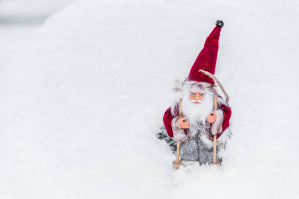 istock Santa Doll with Skis on Snow for Christmas 1191821082