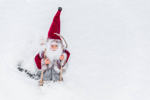 istock Santa Doll with Skis on Snow for Christmas 1191821094