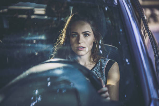 istock Young beautiful woman going on a trip by car. 1191821108