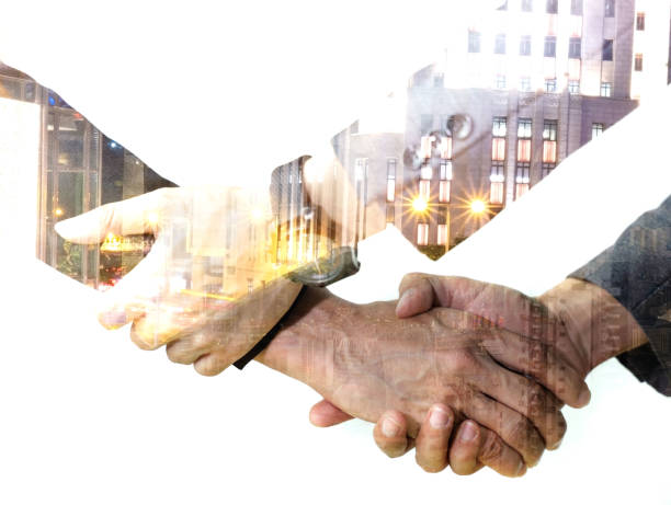istock Double exposure of Business Partners holding hands with Help, trust ,support ,empathy and factors relationship marketing for reach successful achievement and meeting commit concept. 1191828262
