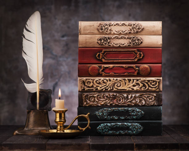 istock stack old vintage books on shelf, antique inkwell and feather for writing 1191829199
