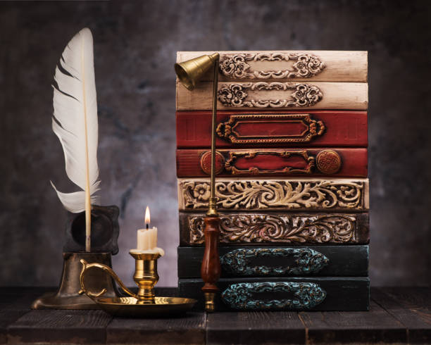 istock stack old vintage books on shelf, antique inkwell and feather for writing 1191830500