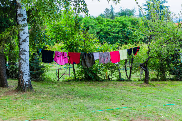 Dry Blankets After Washing in the Sun on a Wire in the Garden Outside the House