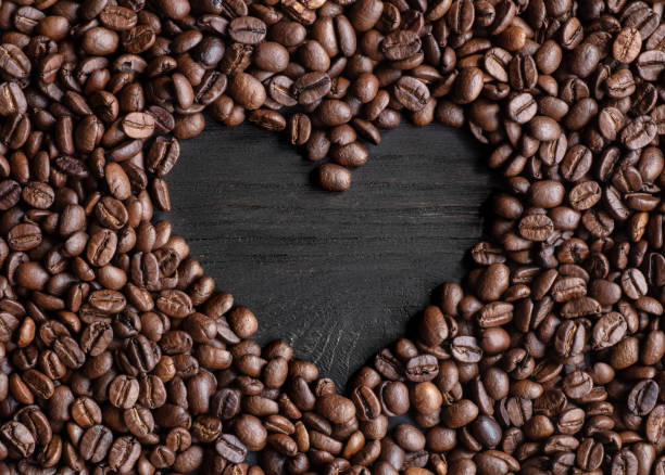 Heart-shaped coffee beans stock photo