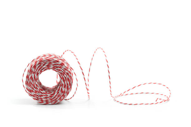istock Red and white bakers twine rope spool isolated on white background. Packaging equipment or handicraft tool concept. 1191836449