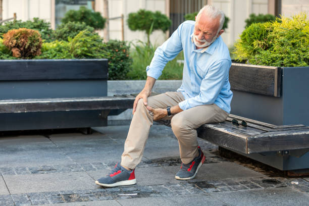 istock Senior Businessman with Knee Problems in the City Streets 1191836614