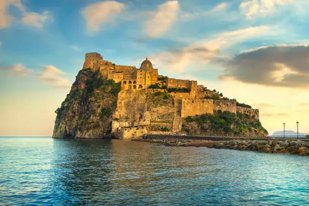 Photo of Ischia island and Aragonese medieval castle. Campania, Italy.
