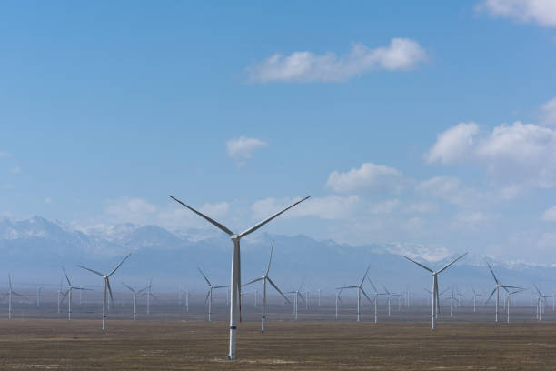 istock wind power plant on dry grassland 1191838624