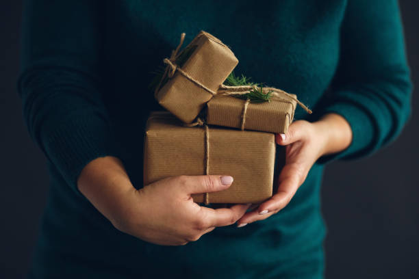 istock Woman holding wrapped Christmas presents 1191838709