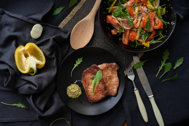 istock fried meat with vegetable salad and pesto. 1191838767