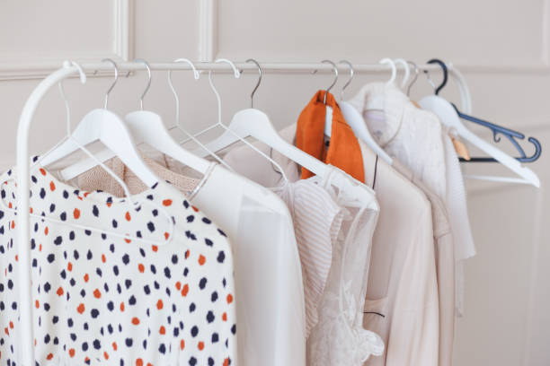 istock Clothes hang on a shelf in a designer clothes store 1191839242