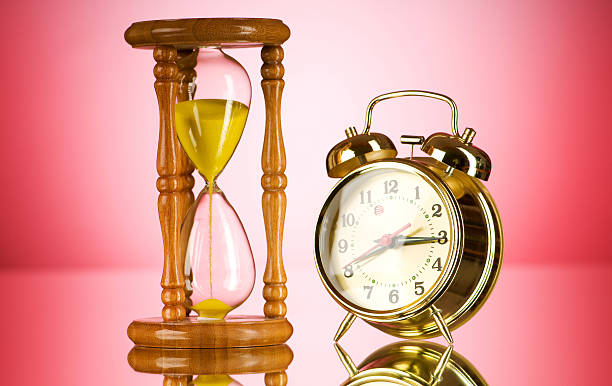 istock Time concept with clock and hour glass 119184141