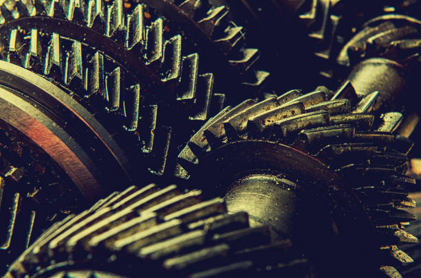 Engine gear wheels, industrial on wooden background stock photo