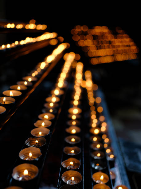 istock Many burning candles with shallow depth of field 1191845820