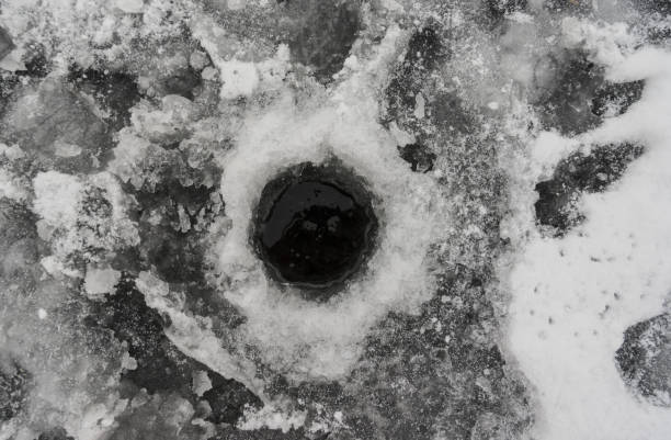istock Fishing hole on the lake. 1191846004