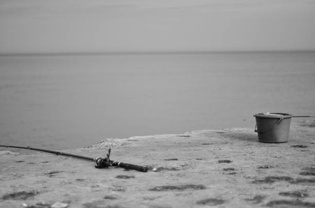 fishing black and white photo