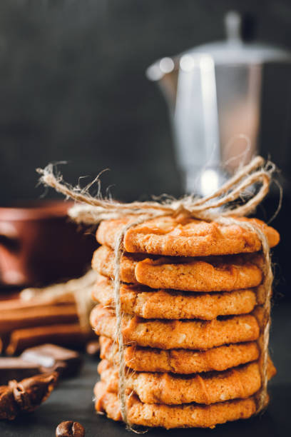 istock Homemade chip cookies stacked on dark background 1191849259