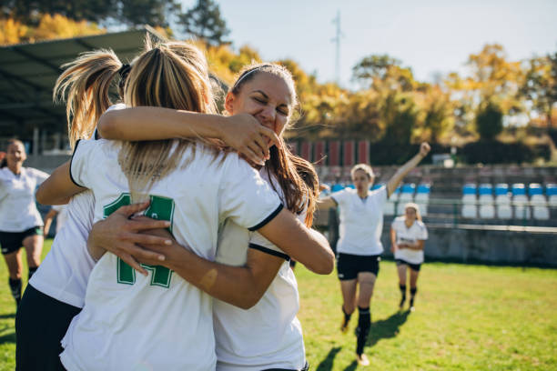 istock Happy soccer players celebrating victory 1191849687