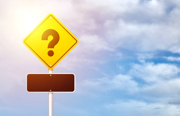 Yellow Road Traffic Sign with Question Mark on Blue Sky