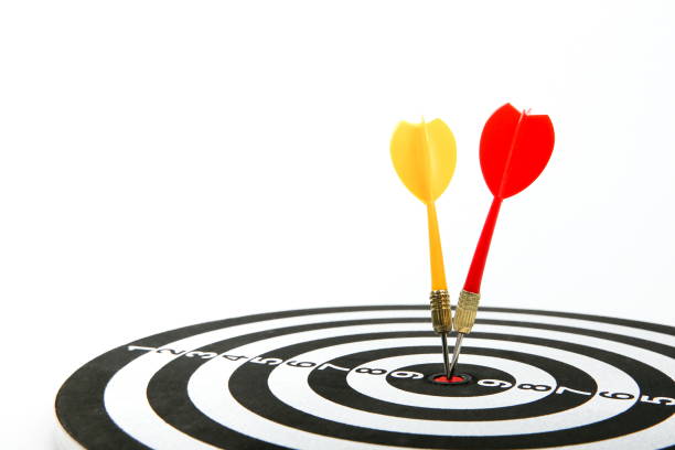 istock dartboard and two darts in it on a white background with copy space 1191852146