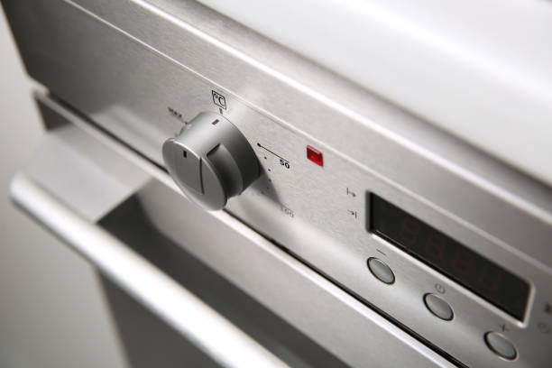istock knob on silver kitchen stove close up 1191852149
