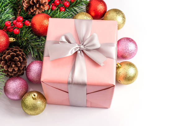 istock Beautiful pink gift box with Christmas ornaments 1191852154