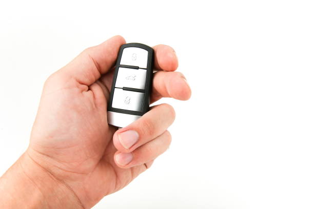 istock hand holding car key on white background with copy space 1191852237