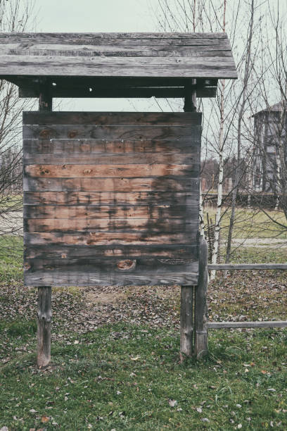 istock Wooden old stand with a visor for hanging ads, copy space. 1191852623