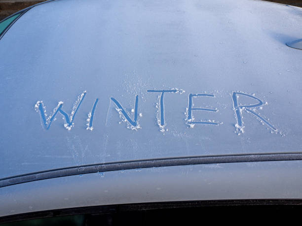 istock Winter written in the ice on a car windscreen 1191852651