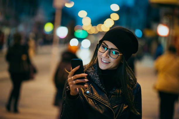 istock Young woman texting on the phone 1191853617