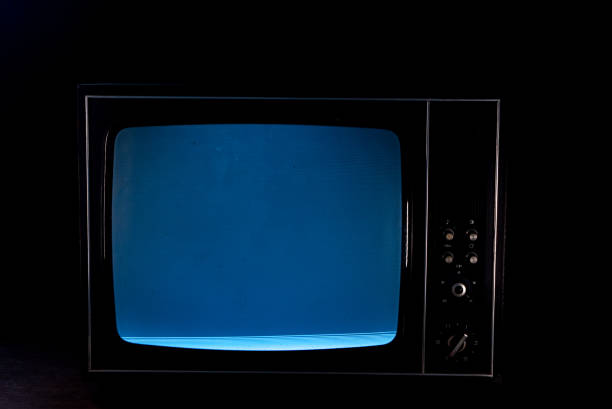 istock Static noise on a vintage TV set in black background 1191854981