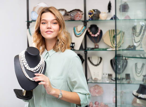 istock Girl showing pearl necklace 1191856113