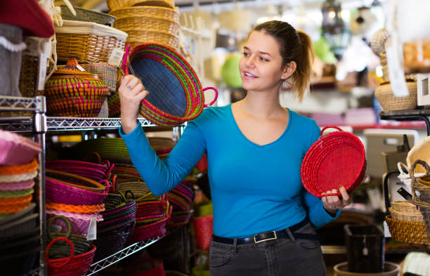 istock female  choosing  multicolor wicker basket 1191856162