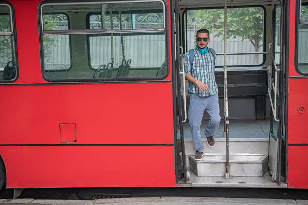 istock Young Man with Headphones is Exiting the Bus 1191856224