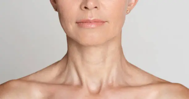Photo of Skin care. Half face portrait of mature woman