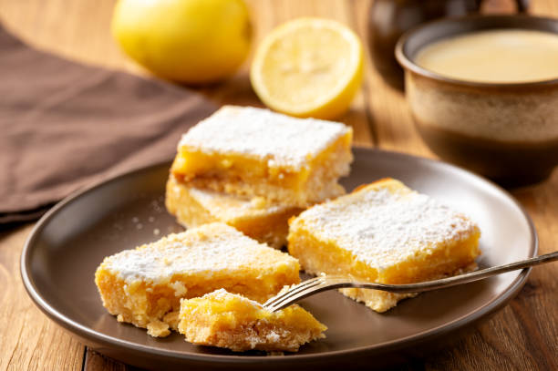 istock Homemade lemon bars with shortbread crust, on wooden background. 1191856675