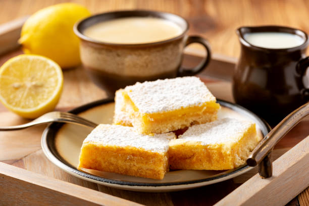 istock Homemade lemon bars with shortbread crust, on wooden background. 1191856681