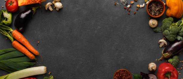 istock Fresh organic vegetables frame on black background 1191857423