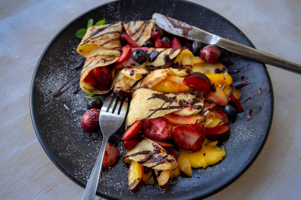 istock Crepes with Fresh Berries, Chocolate Sauce and Powdered sugar 1191858087