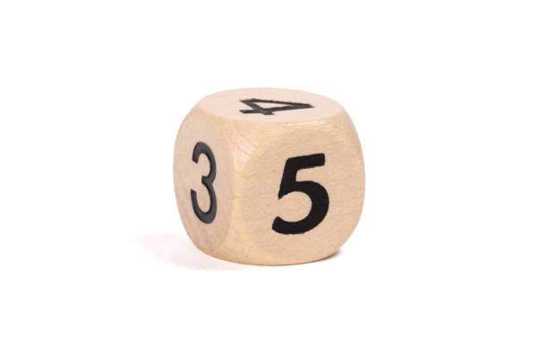 istock Small wooden dice, numbers written on it, isolated on white 1191859099