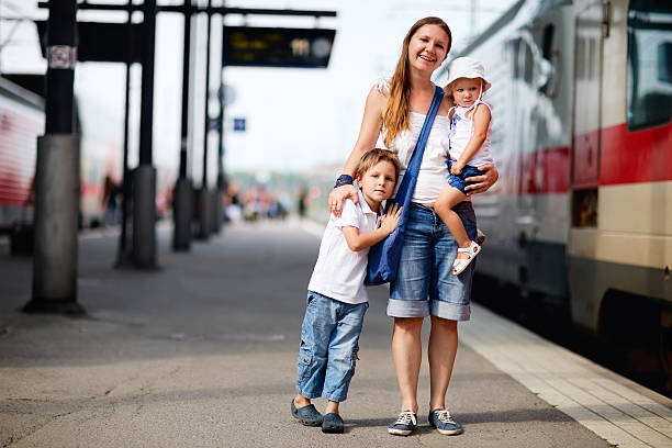 istock Mother and two kids waiting for train 119186200