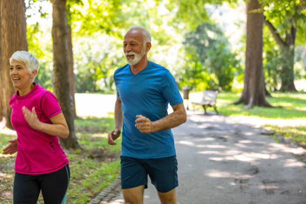 istock Mature Couple is Running in Public Park 1191862617