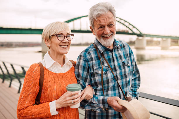 istock Senior couple on vacation enjoying by the river 1191865371