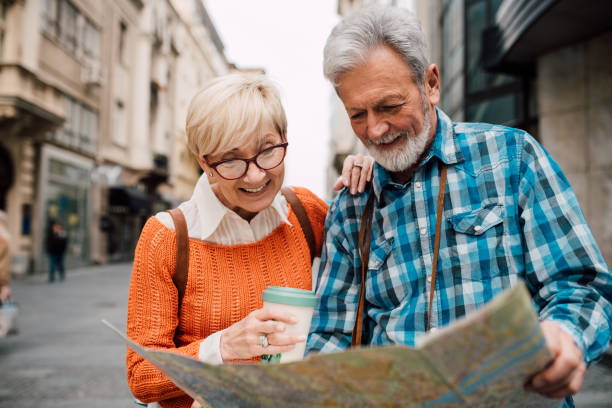 istock Senior couple on a journey  exploring the city map 1191865410