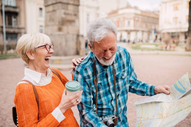 istock Senior tourists exploring the city map and having fun 1191865415