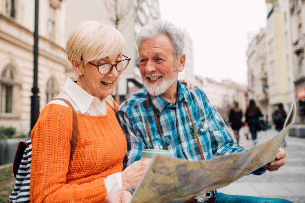 istock Senior tourists exploring the city map 1191865420